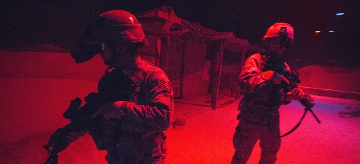 U.S. Air Force Airmen with the 514th Security Forces Squadron, 514th Air Mobility Wing, maneuver through the indoor urban operations site during a training exercise at the New Jersey National Guard's Joint Training and Training Development Center.