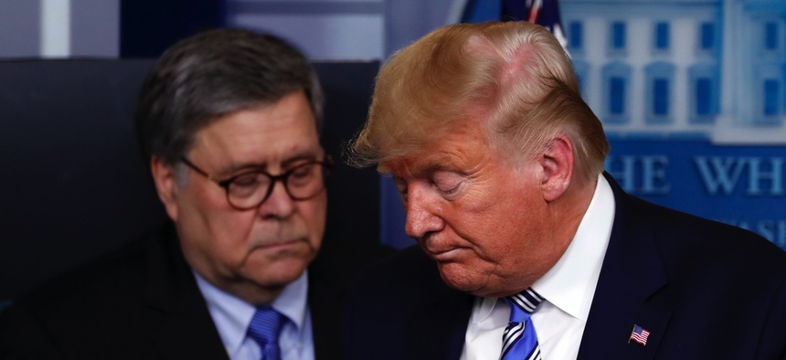 President Donald Trump moves from the podium to allow Attorney General William Barr to speak about the coronavirus in the James Brady Briefing Room, Monday, March 23, 2020, in Washington.