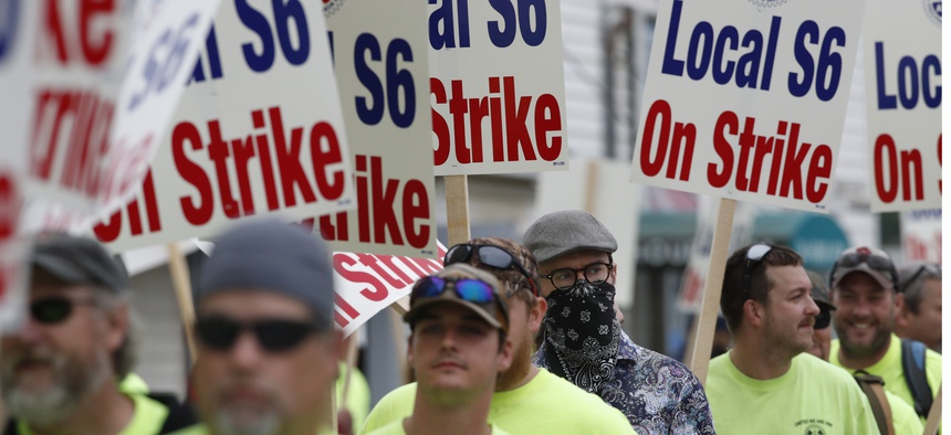 Striking shipbuilders picket outside an entrance to Bath Iron Works, Monday, June 22, 2020, in Bath, Maine.