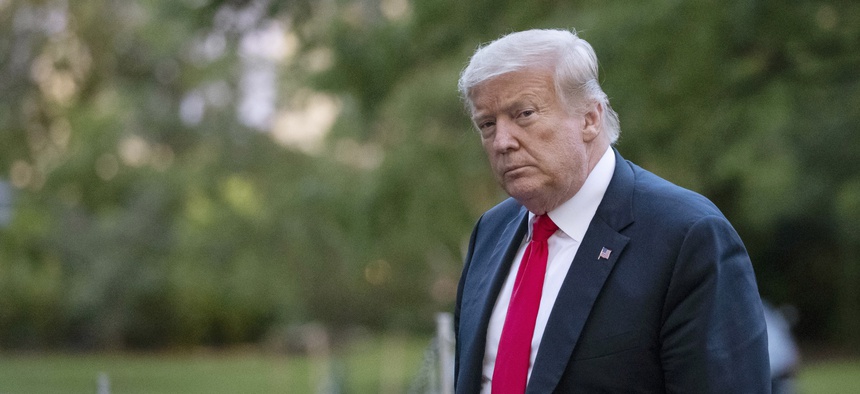 President Donald Trump walks on the South Lawn after arriving on Marine One at the White House in Washington. The president's brother Robert Trump has filed a second court action seeking to halt publication of a tell-all book by the president's niece.