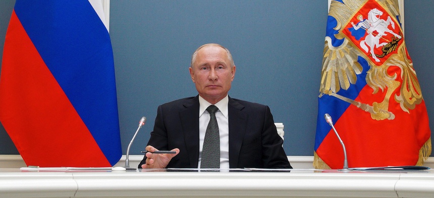 Russian President Vladimir Putin attends a video call with Defense Minister Sergei Shoigu in Moscow, Russia, Tuesday, June 30, 2020