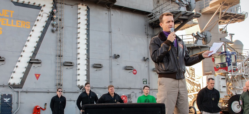 Capt. Brett Crozier, commanding officer of the aircraft carrier USS Theodore Roosevelt (CVN 71), gives remarks during an all-hands call on the ship’s flight deck Dec. 15, 2019.