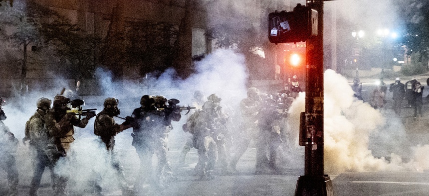 Federal agents use crowd control munitions to disperse Black Lives Matter protesters near the Mark O. Hatfield United States Courthouse on Monday, July 20, 2020, in Portland, Ore.