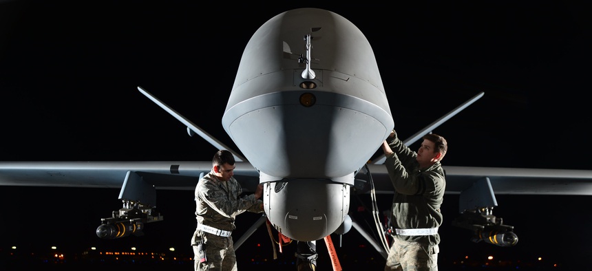 Airmen prepare an MQ-9 Reaper for flight during a 2014 exercise at Creech Air Force Base, Nevada.
