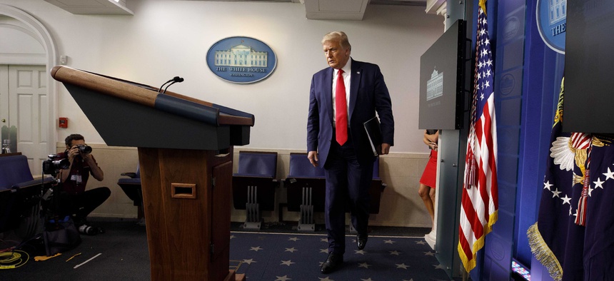 President Donald Trump arrives for a news conference at the White House, Thursday, July 23, 2020, in Washington.