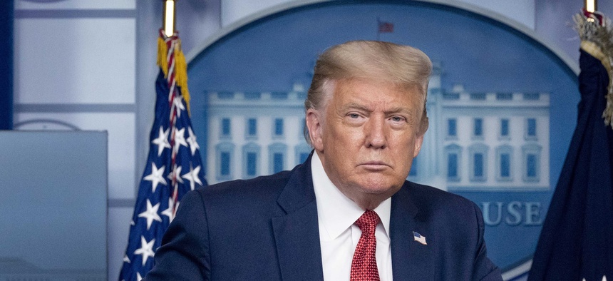 President Donald Trump holds a news conference at the White House on Aug. 10.