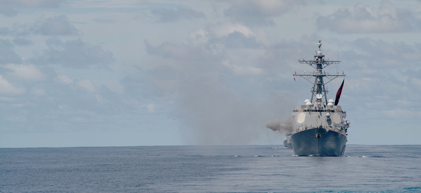 The Arleigh Burke-class guided-missile destroyer USS Sterett (DDG 104) fires its Mark 45 5-inch gun during a live-fire exercise in the Indian Ocean with the Nimitz Carrier Strike Group, July 20, 2020.