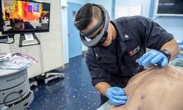  A sailor wears augmented goggles to relay a live-stream video of the procedure to a doctor in San Diego during a tele-procedural mentorship scenario to test the capabilities of the augmented goggle technology.