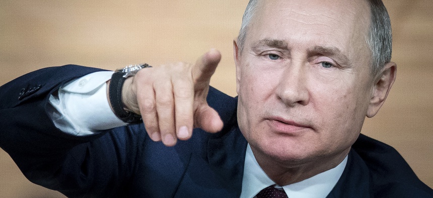 Russian President Vladimir Putin gestures during his annual news conference in Moscow in December 2019.