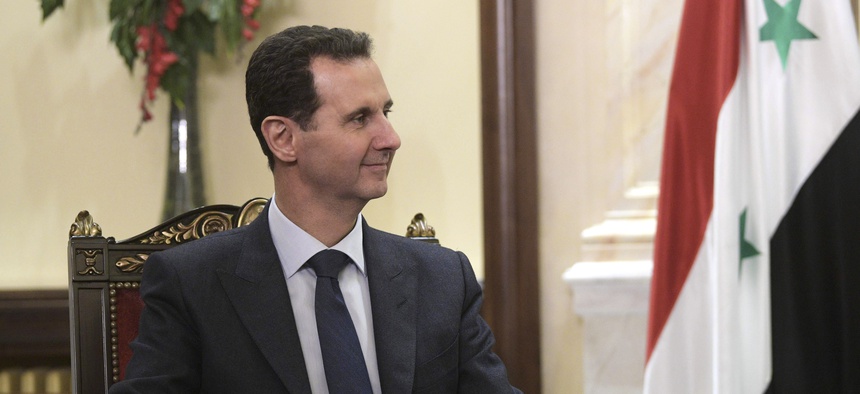 Syrian President Bashar Assad listens to Russian President Vladimir Putin during their meeting in Damascus, Syria, Tuesday, Jan. 7, 2020.