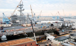 The aircraft carrier USS Dwight D. Eisenhower (CVN 69) sits in dry dock during a 14-month scheduled docking planned incremental availability at Norfolk Naval Shipyard.
