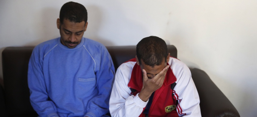 In this March 30, 2019 photo, Alexanda Amon Kotey, left, and El Shafee Elsheikh, who were allegedly among four British jihadis who made up a brutal Islamic State cell dubbed "The Beatles," speak during an interview with The Associated Press in Syria.