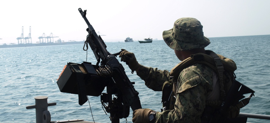 A U.S. sailor assigned to Coastal Riverine Squadron 10 provided seaward security for a vessel at the Port of Djibouti in 2015.