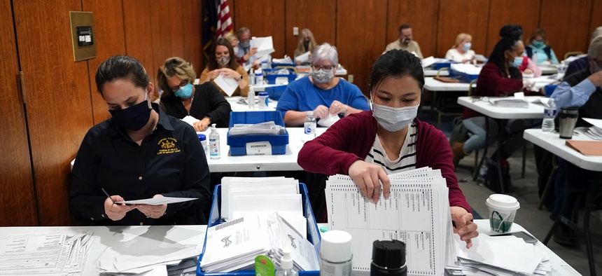 Election workers sort ballots at the Dauphin County Administration Building in Harrisburg, Pennsylvania, on Nov. 3, 2020.