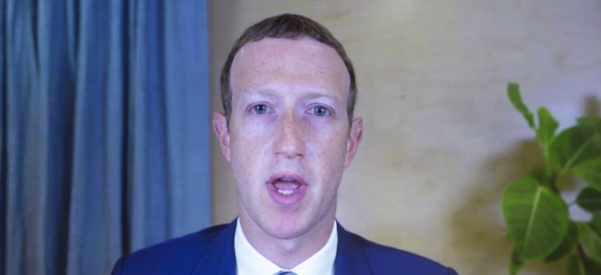 Facebook CEO of Mark Zuckerberg appears on a screen as he speaks remotely during a hearing before the Senate Commerce Committee on Capitol Hill, Wednesday, Oct. 28, 2020, in Washington.
