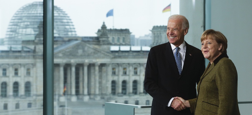 German Chancellor Angela Merkel, right, and United States' Vice President Joe Biden brief the media prior to a meeting at the chancellery in Berlin, Germany, Friday, Feb. 1, 2013.