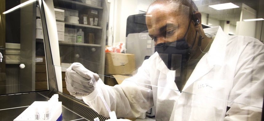 U.S. Army Spc. Donald Lockhart, laboratory technician, Department of Pathology and Laboratory Services, Landstuhl Regional Medical Center, prepares a COVID-19 sample for testing at LRMC, Nov. 3.