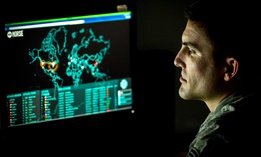 An Airman monitors live cyber attacks on the operations floor of the 27th Cyberspace Squadron, known as the Hunter's Den, at Warfield Air National Guard Base, Middle River, Md., June 3, 2017. 