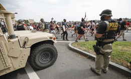 DC National Guard soldiers and other law enforcement personnel watch as demonstrators protest Saturday, June 6, 2020, along Independence Avenue in Washington, over the death of George Floyd, a black man who was in police custody in Minneapolis. 