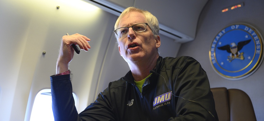 Acting Defense Secretary Chris Miller speaks to reporters on a government aircraft en route to Joint Base Andrews, Md., Jan. 14, 2021