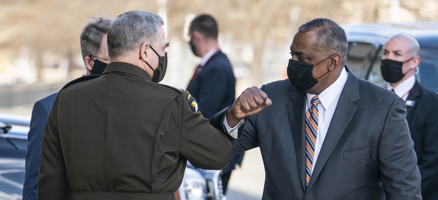 Mark Milley, chairman of the Joint Chiefs of Staff, greets incoming Secretary Of Defense Lloyd Austin III outside of the Pentagon on Austin's first day in his new role on January 22, 2021 in Arlington, Virginia.