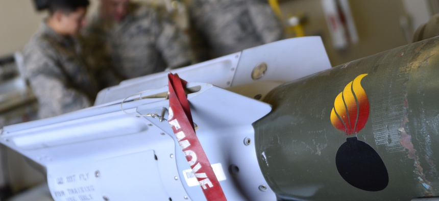 Airmen reviews safety precautions before building GBU-12 Paveway II laser-guided bombs at Creech Air Force Base.