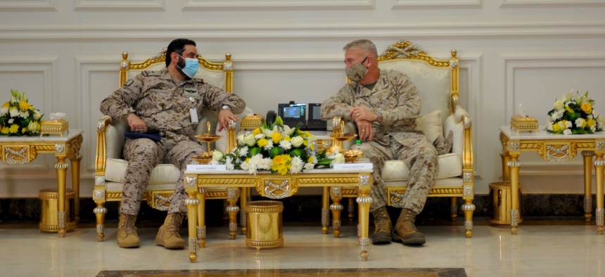 U.S. Marine Corps Gen Frank McKenzie, CDR, U.S. Central Command sits with Saudi Arabian Maj. Gen. Khalid bin Abdullah AlShablan, commander, Prince Sultan Air Base, during a visit to Prince Sultan Air Base, Kingdom of Saudi Arabia, July 9, 2020.