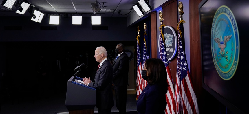 President Joe Biden speaks as Secretary of Defense Lloyd Austin and Vice President Kamala Harris accompany him at the Pentagon, February 10, 2021, in Washington, DC. - Harris and Biden are visiting the Pentagon for the first time since taking office.
