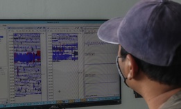 LUMAJANG, INDONESIA, JANUARY 17: An official monitors the seismograph used to monitor the eruption of Mount Semeru in Lumajang, East Java Province, on January 17, 2021. Mount Semeru erupted on January 16, 2021