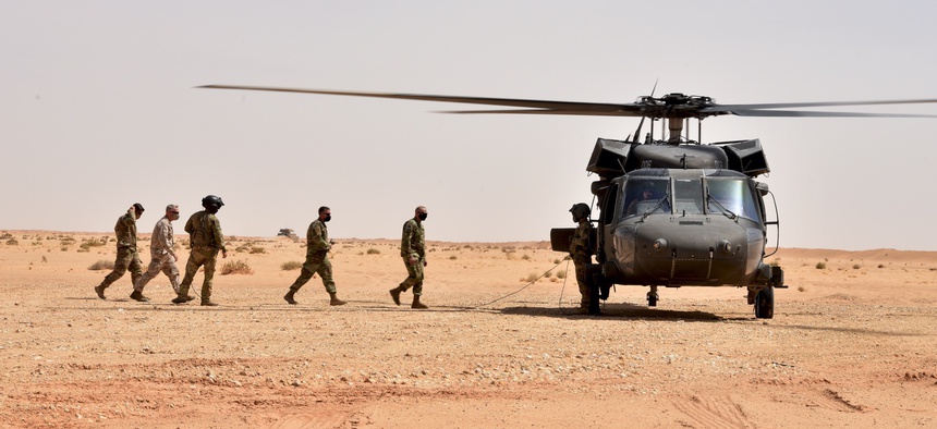 The authors argue that more funding should be driven by combatant commanders such as U.S. Central Command's Gen. Kenneth McKenzie, seen here boarding a UH-60 Black Hawk in Saudi Arabia in 2020.