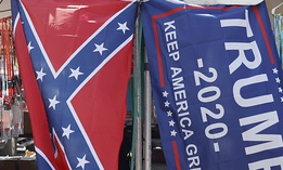 A vendor displays a confederate and Trump 2020 "Make America Great Again!" flag outside of the Bristol Motor Speedway prior to the NASCAR Cup Series All-Star Race at Bristol Motor Speedway on July 15, 2020.