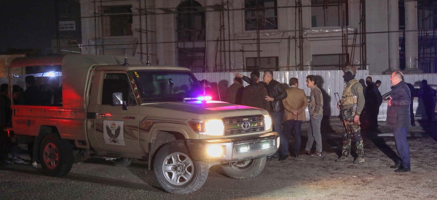 Security forces gather following a rocket attack in Erbil, the capital of the northern Iraqi Kurdish autonomous region, on Feb. 15, 2021.