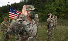 Soldiers from the U.S. Army National Guard and U.S. Army Reserve participate in a reenlistment ceremony Sept. 26, 2020, near Ferizaj/Urosevac, Kosovo.