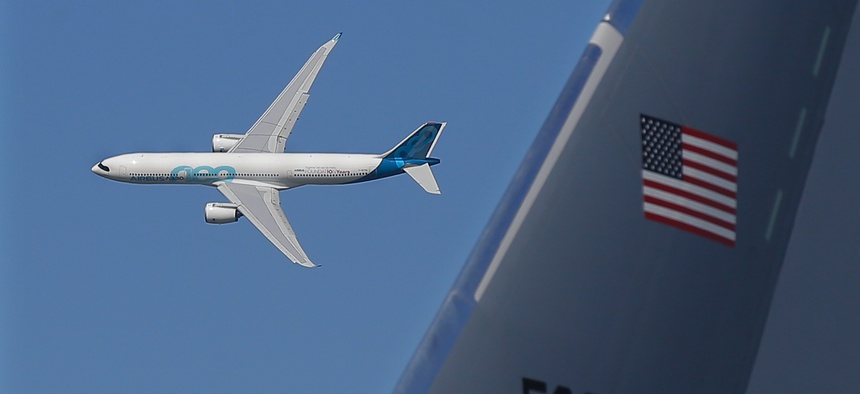 An Airbus A330neo flies past a Boeing KC-46 tanker at the 2019 Paris Air Show.