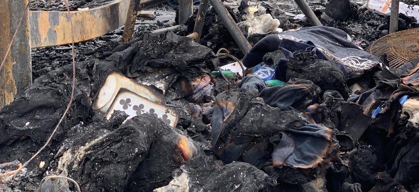 A charred playing card sits in the ruins of a barracks destroyed in a Feb. 15 rocket attack on a base in Erbil, Iraq.