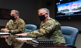 Gen. Mark A. Milley, chairman of the Joint Chiefs of Staff, and Gen. Glen D. VanHerck, commander of USNORTHCOM, talk at Peterson Air Force Base, Colorado Springs, Colo, March 1, 2021.