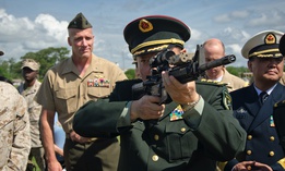 One of the general officers accompanying China's Minister of National Defense shoulders an M4 carbine during a 2012 visit to Marine Corps Base Camp Lejeune, N.C.