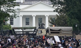 D.C. National Guard vehicles are used to block 16th Street near Lafayette Park and the White House as Demonstrators participate in a peaceful protest against police brutality and the death of George Floyd, on June 3, 2020 in Washington, DC.