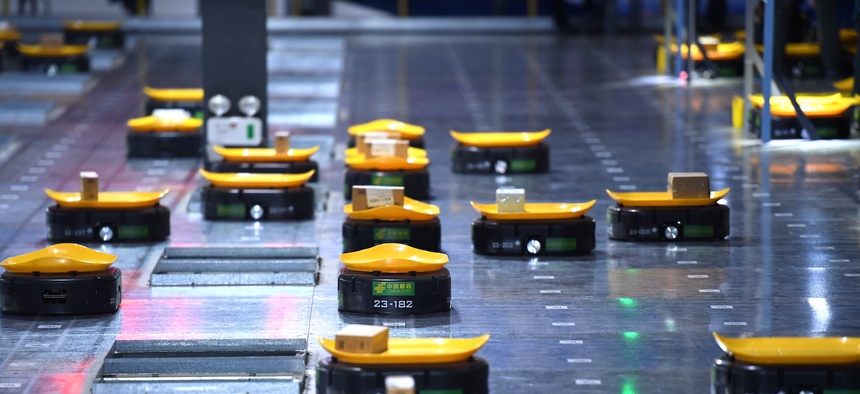 Robots work at a warehouse in China's Anhui province.