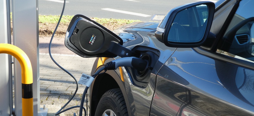21 February 2021, North Rhine-Westphalia, Cologne: An electric car charging at an electric vehicle charging station